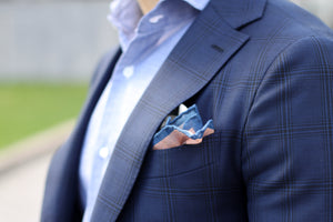 Blue suit jacket with white slacks - classic reformatted