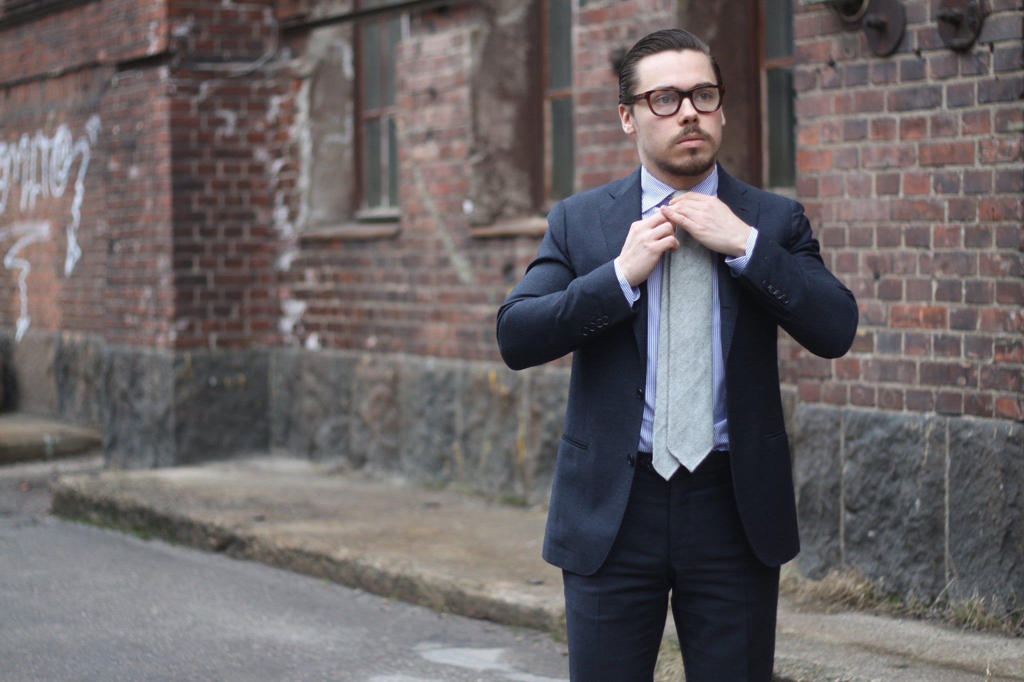 Gray suit with gray tie