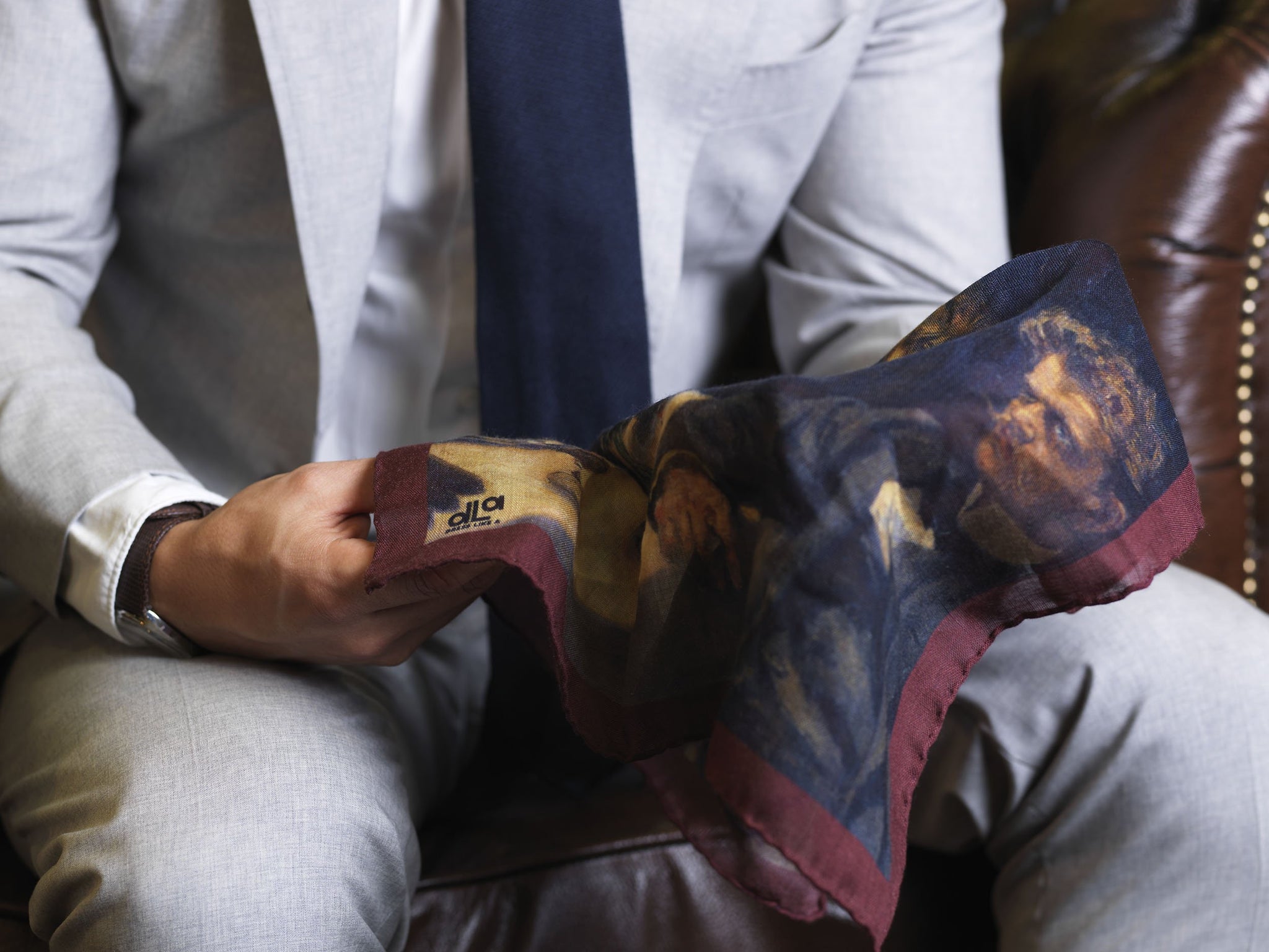 Gray suit with navy grenadine tie