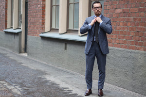 Matching dark gray tie with business suit